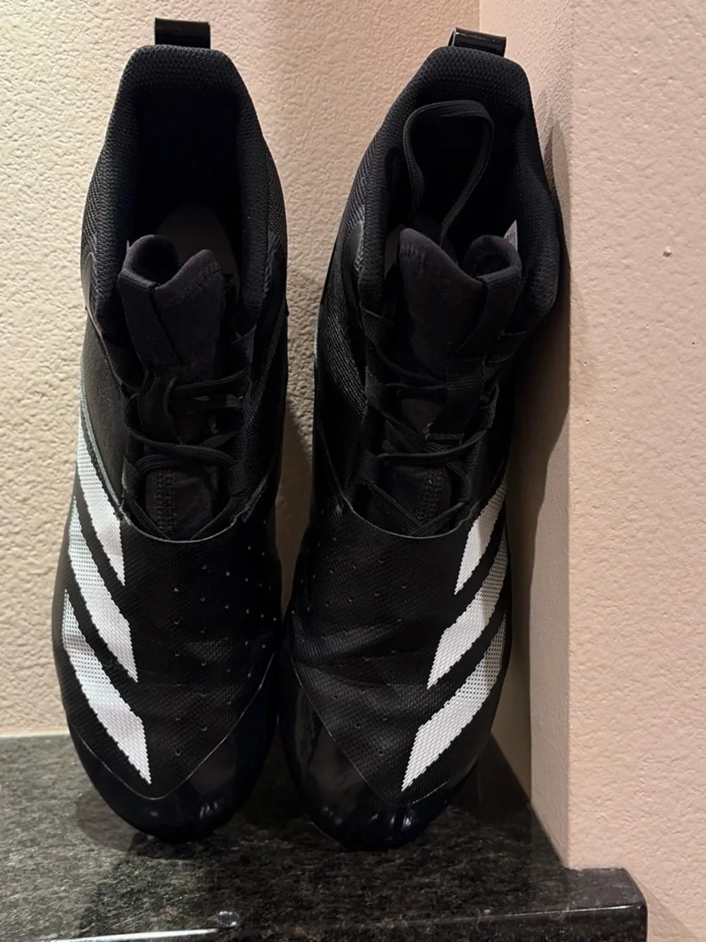 Black Mens Size 11 Football Cleats with White Stripes
